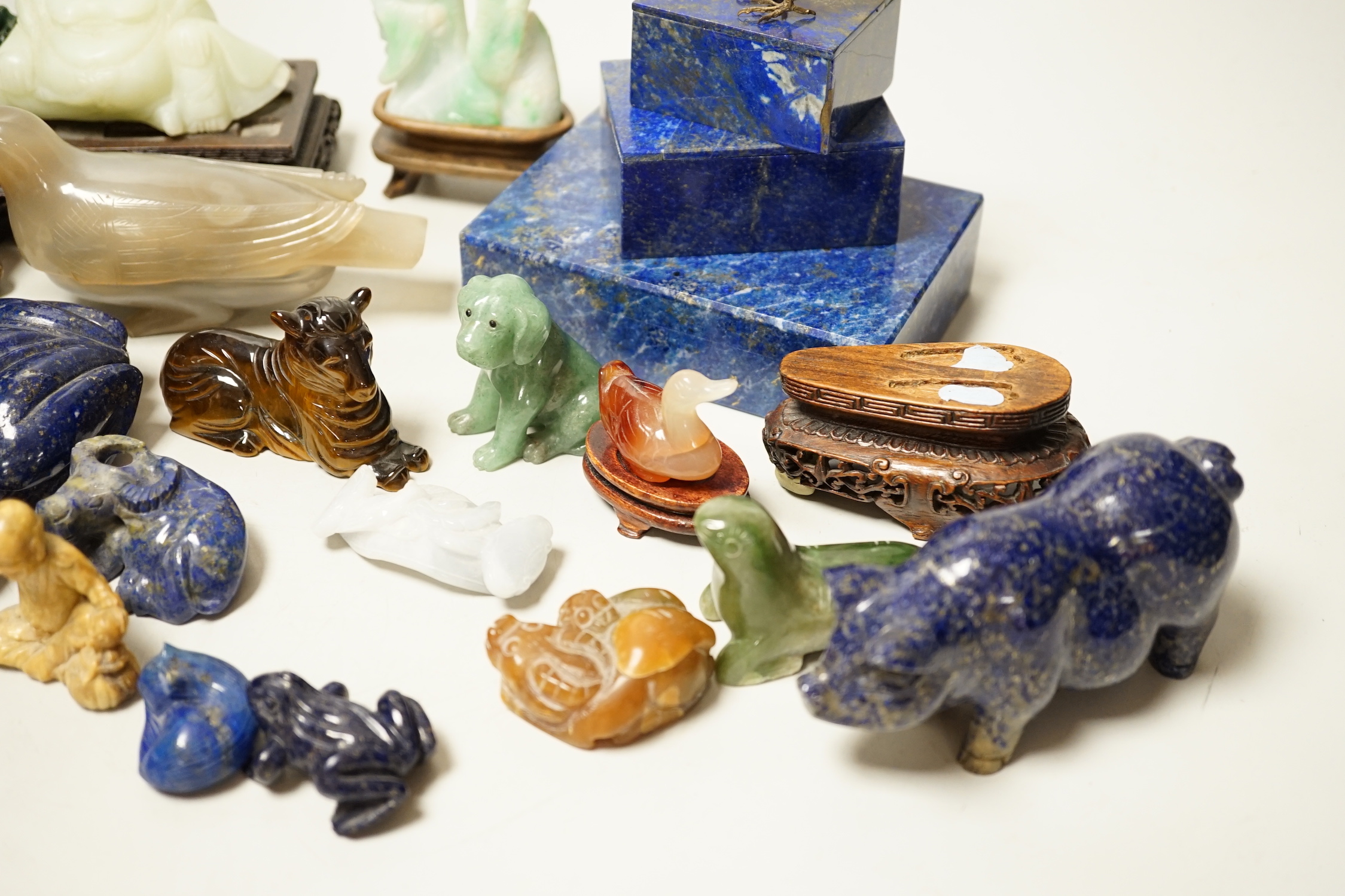 A collection of assorted Chinese hardstone carvings, boxes etc, including a Chinese jadeite carving of a lady, 7.8cm high, wood stand
